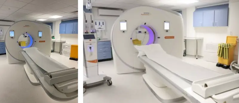 Two side-by-side photos of doughnut-shaped CT scanners