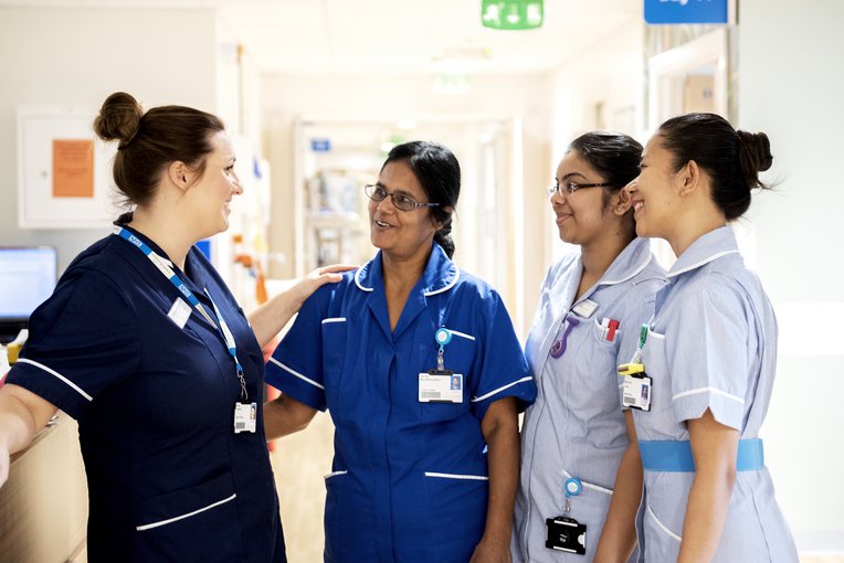 Hospital staff during a standup meeting