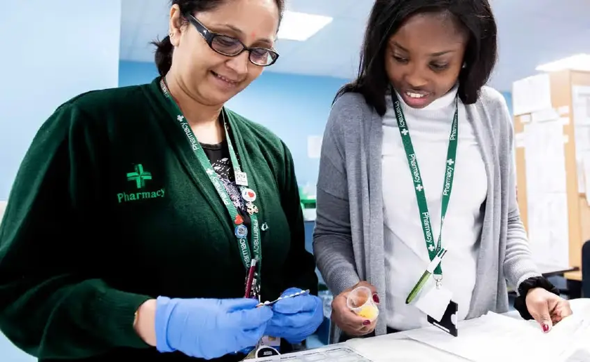 Pharmacy colleagues putting together a prescription