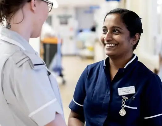 Nurses smiling on a hospital ward