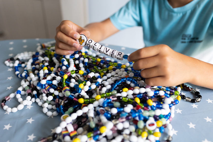 A huge pile of beads of courage that Oliver received each time he had a cancer treatment or hospital appointment. He has thousands of them