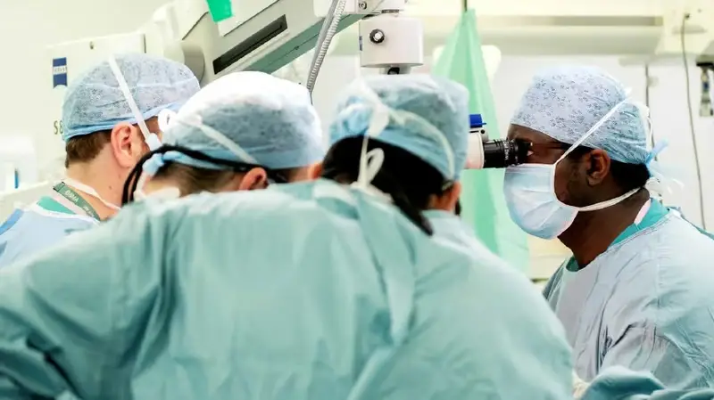 Surgeon and team in operating theatre