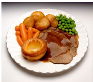 Image of roast beef, yorkshire pudding, peas, potatoes, carrots and gravy